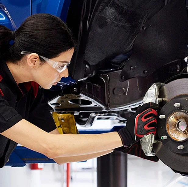 Toyota Certified Auto Repair Technician Checking Genuine Vehicle Parts