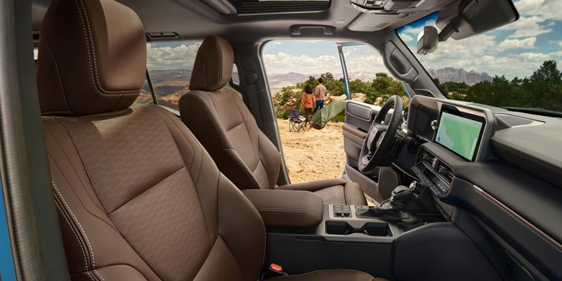 2027 Toyota Land Cruiser equipped with the factory High Mounted Air Intake on a dirt road