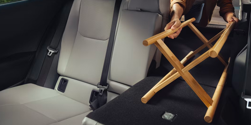 2027 Toyota Prius exterior profile driving on a highway