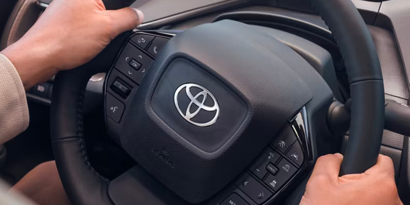 2027 Toyota Prius front three-quarter view showing aerodynamic LED headlamps